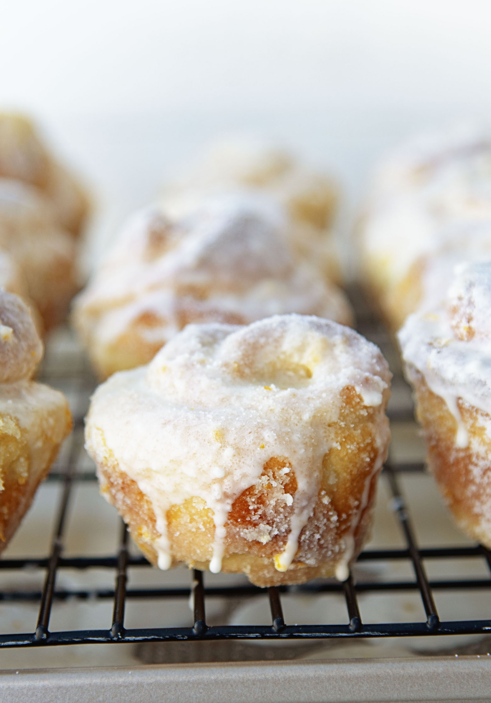 Rows of Mimosa Sugared Sweet Rolls on a wire rack. 