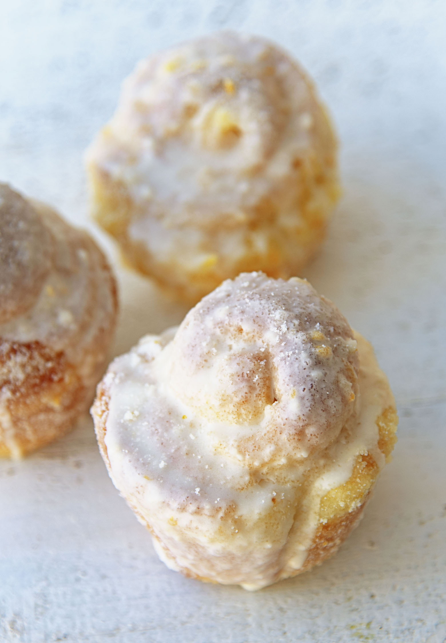 Three Mimosa Sugared Sweet Rolls together. 