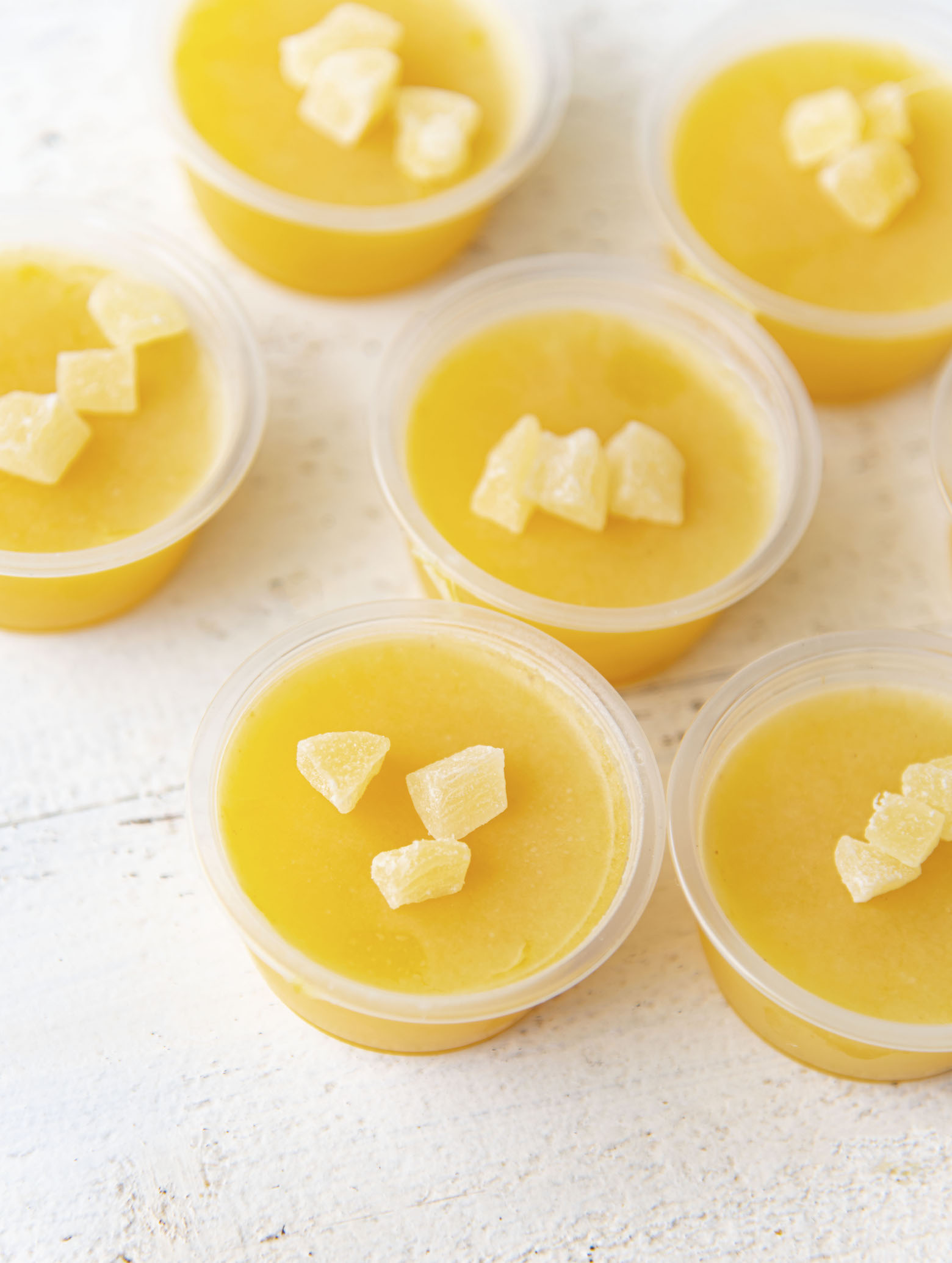 Overhead shot of several Painkiller Cocktail Jello Shots grouped together.