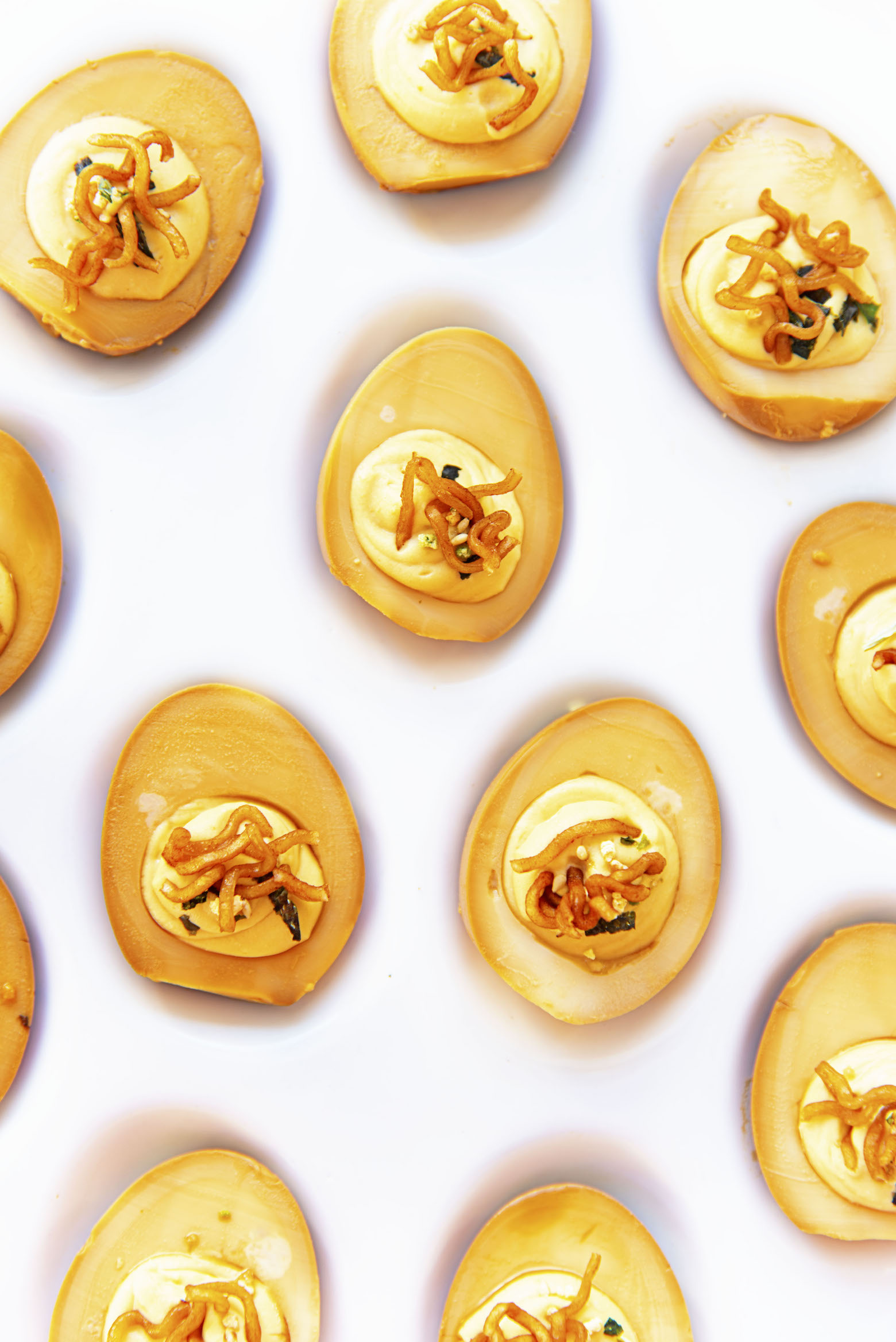 Overhead shot of Soy Sauce Ramen Deviled Eggs on platter.