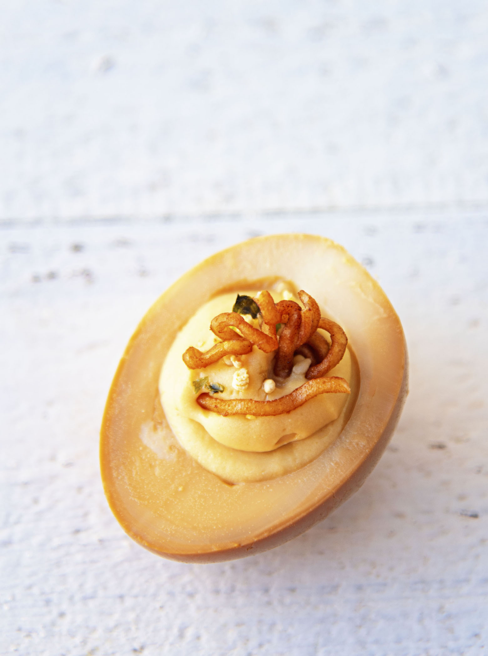 Overhead view of a single Soy Sauce Ramen Deviled Egg