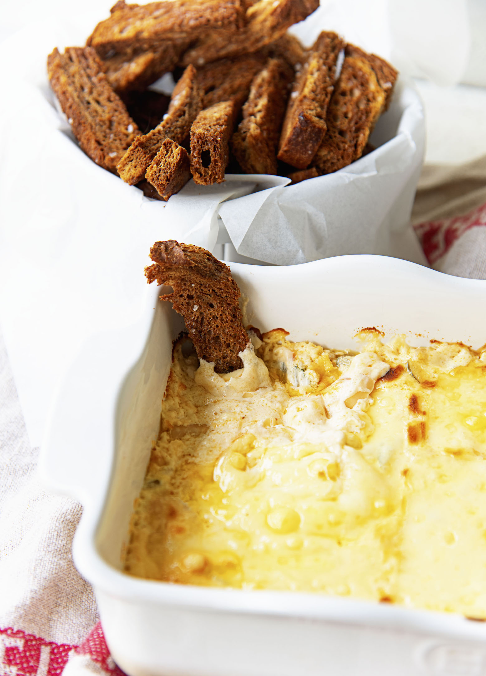 Rye crouton in the dip.