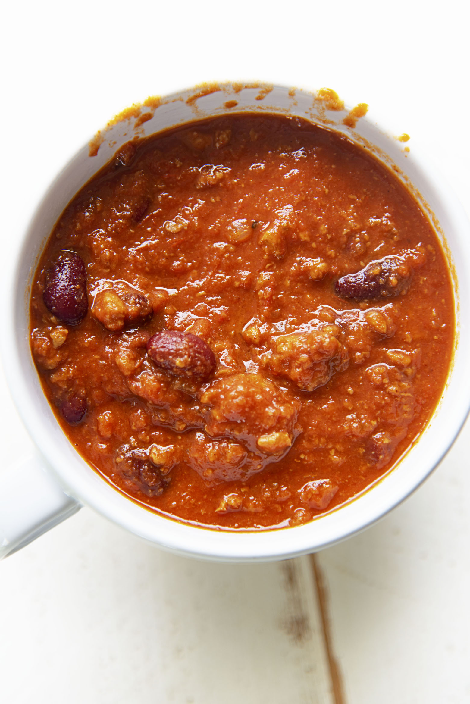 Overhead shot of a bowl of chili. 