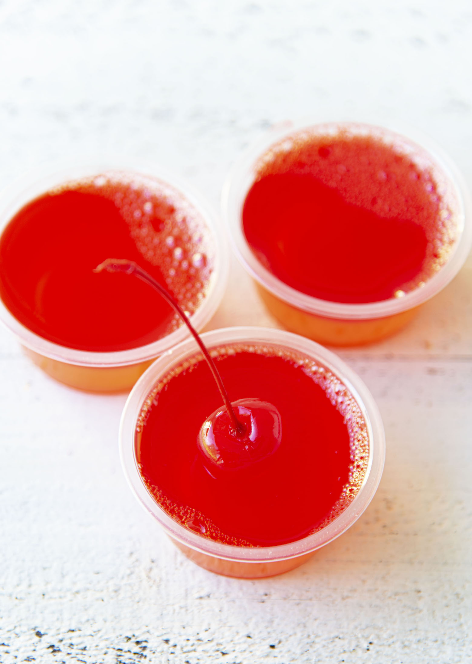 Overhead of three Hurricane Cocktail Jello Shots.