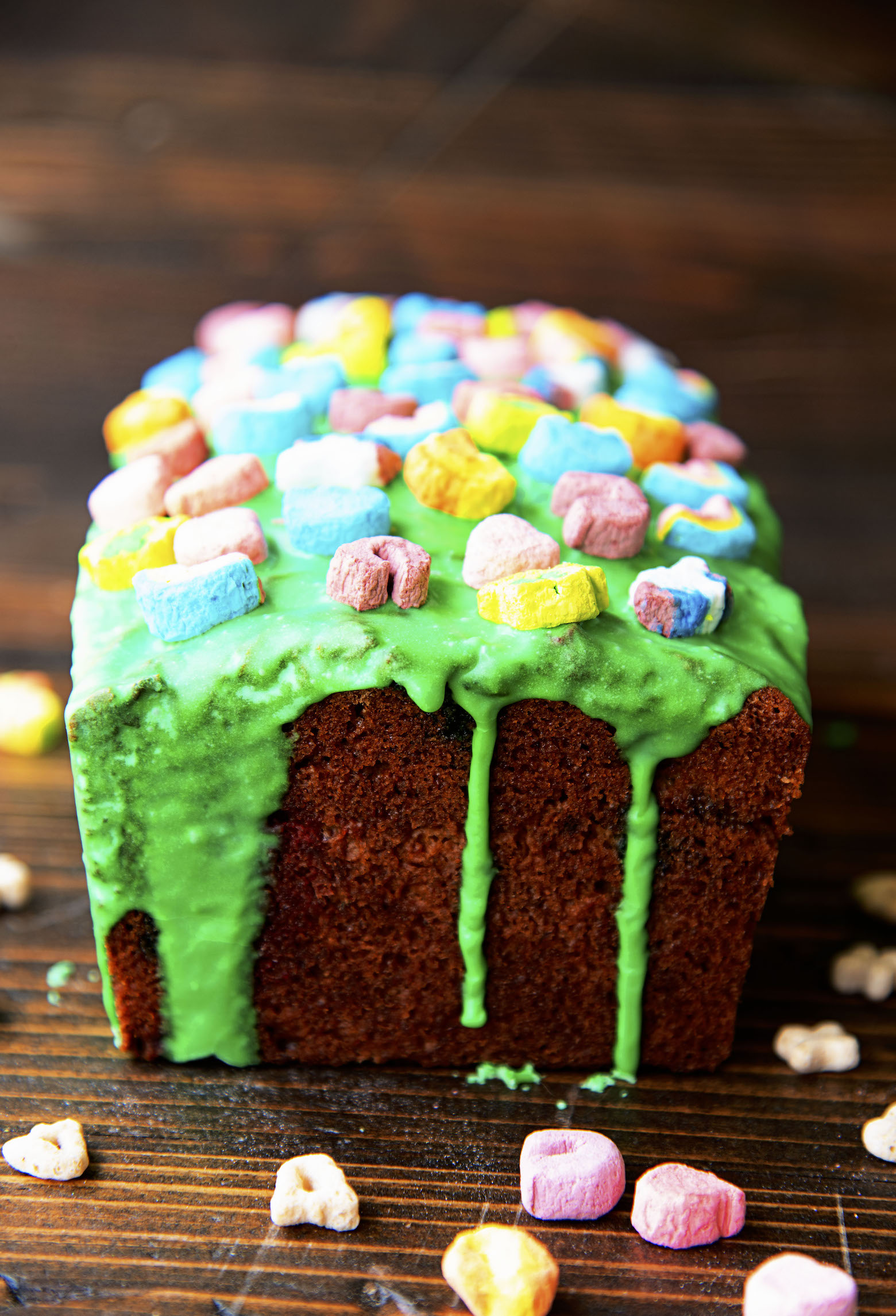 Side view of glaze dripping down the Lucky Charms Banana Bread