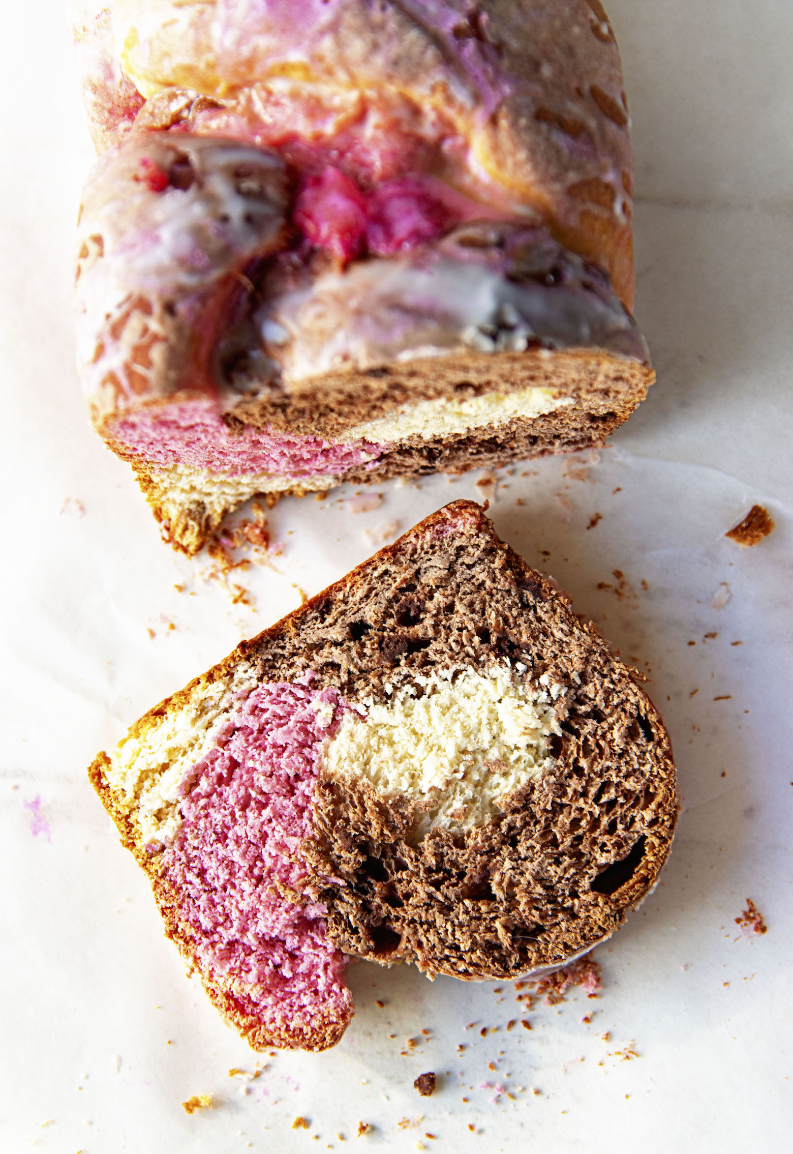 Overhead shot of the babka cut with a slice down to expose the inside. 