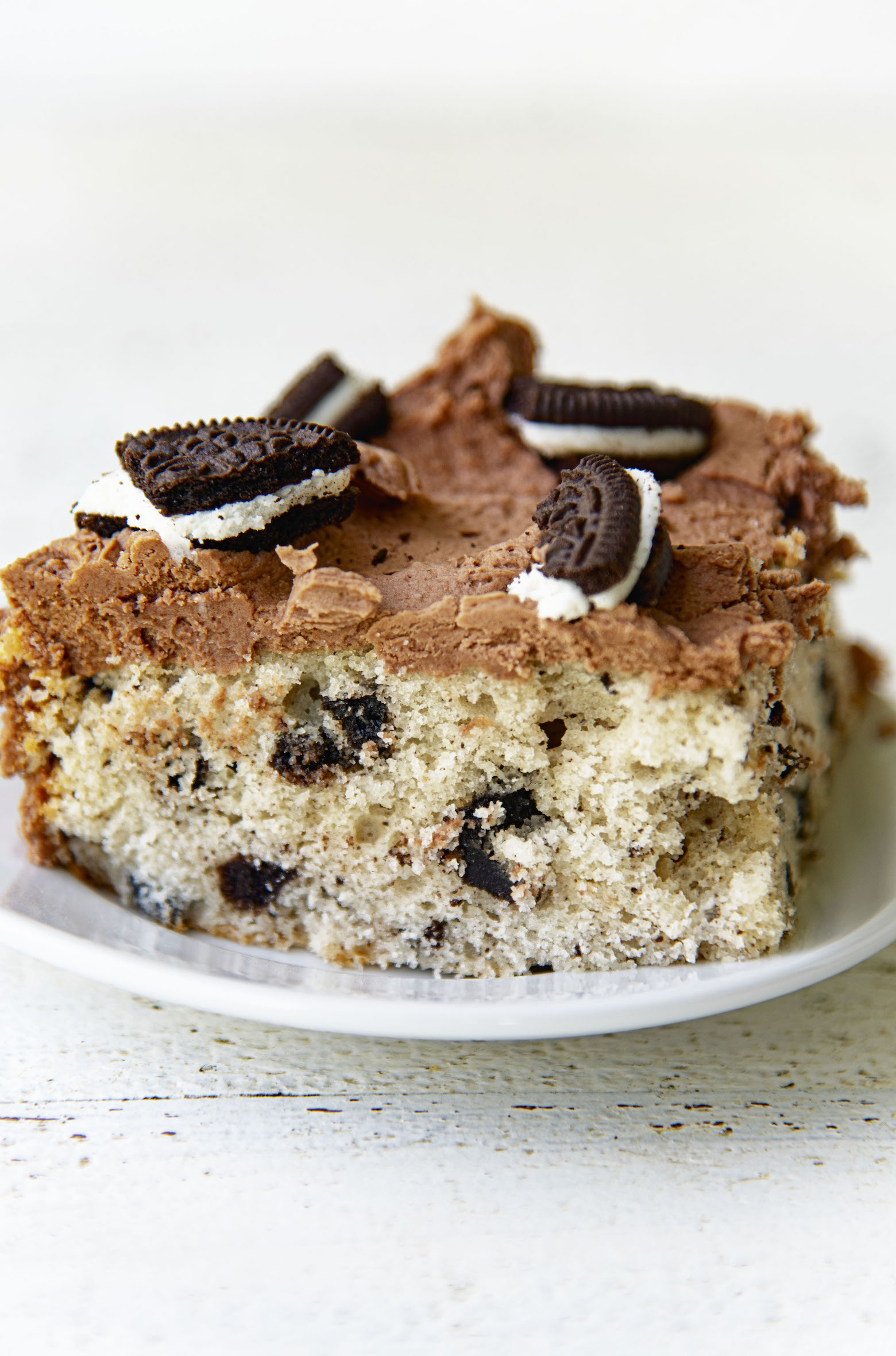 Side view of piece of cake on a small plate.