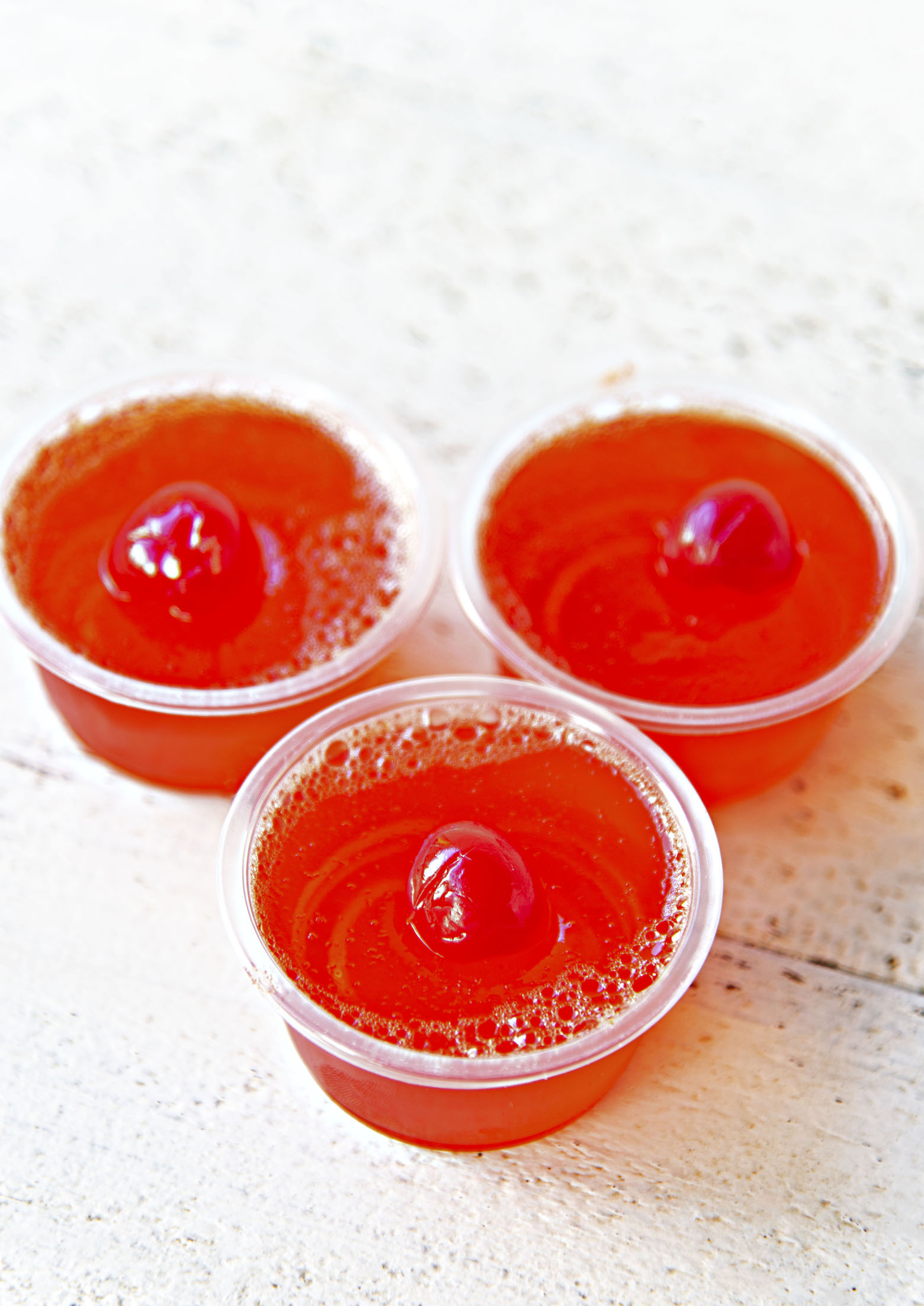 Three quarter view of three Hawaiian Punch Jello Shots