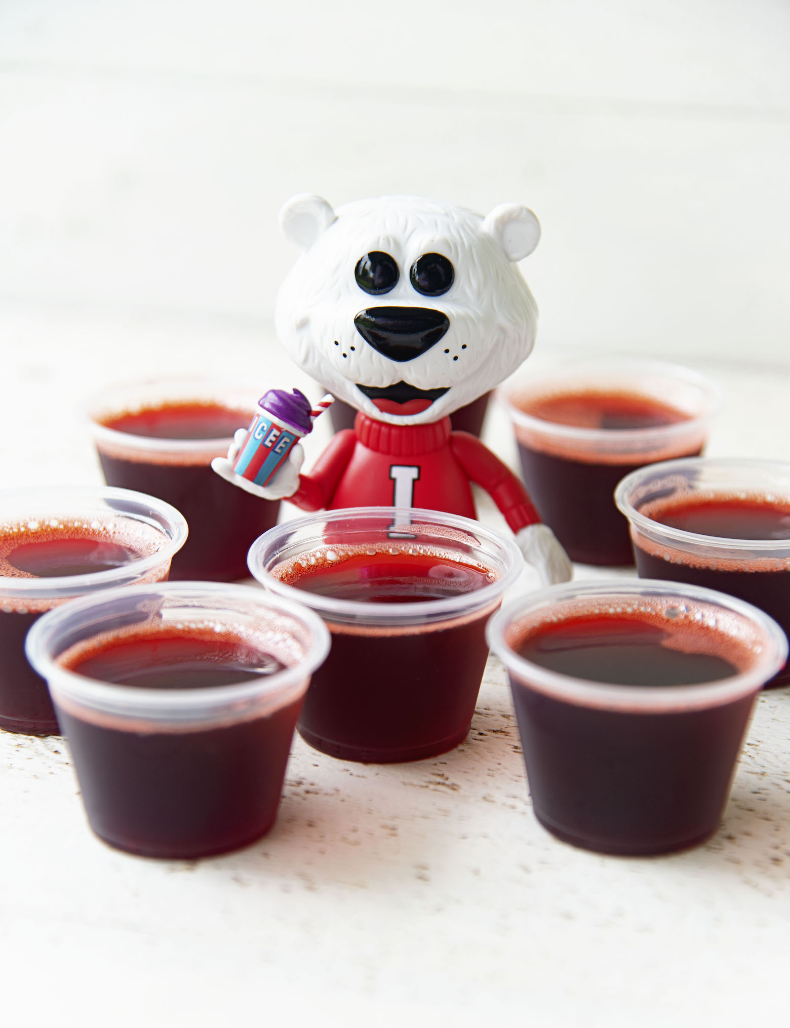 Group of jello shots with Icee Bear in middle and the main focus of the shot.