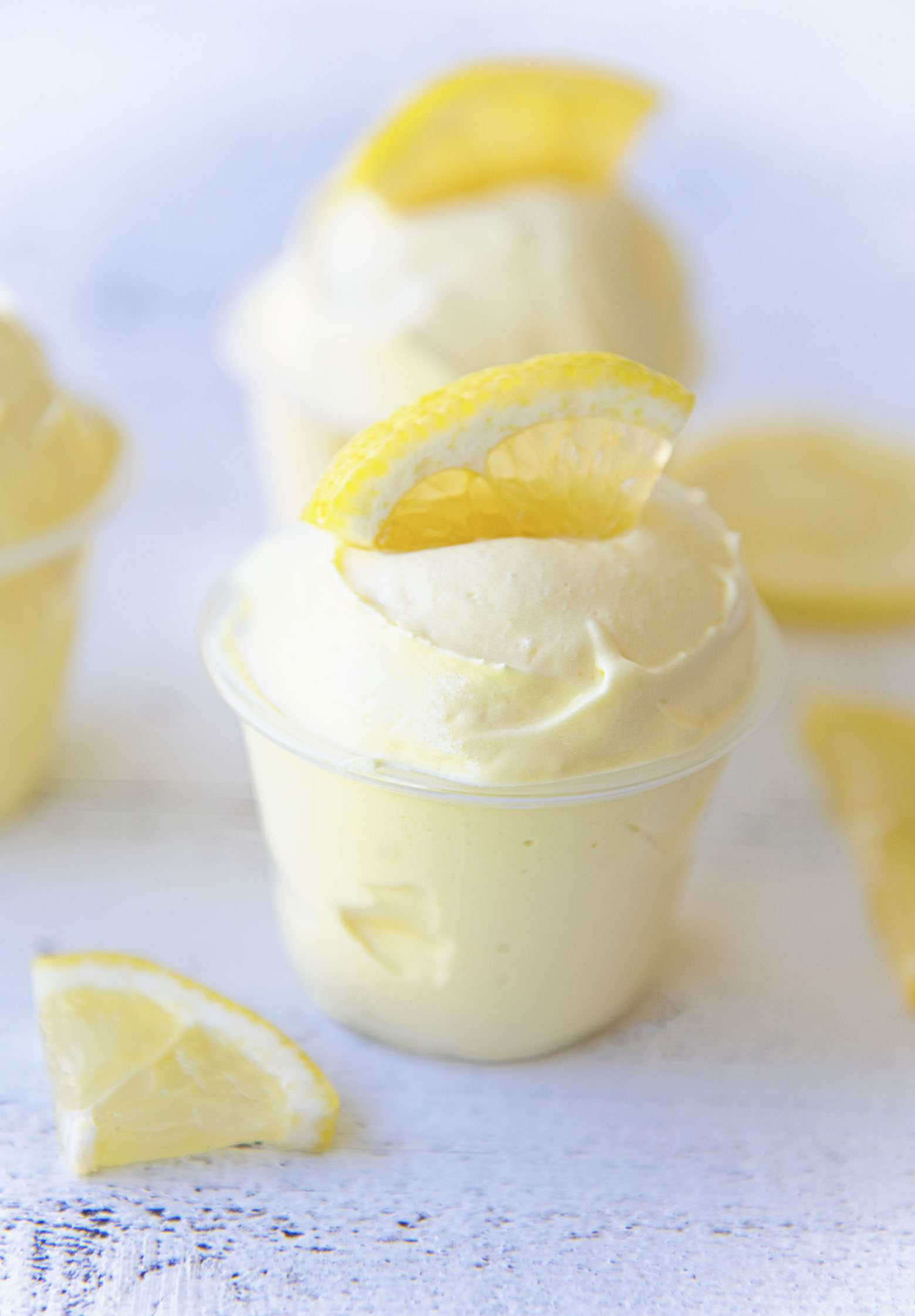 Close up of a Frosted Lemonade Pudding Shot with another shot in the background. 