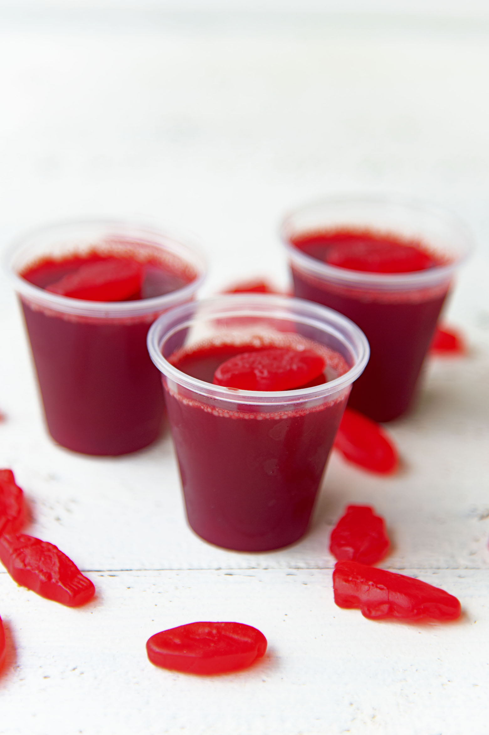 Side view of three Swedish Fish Jello Shots.