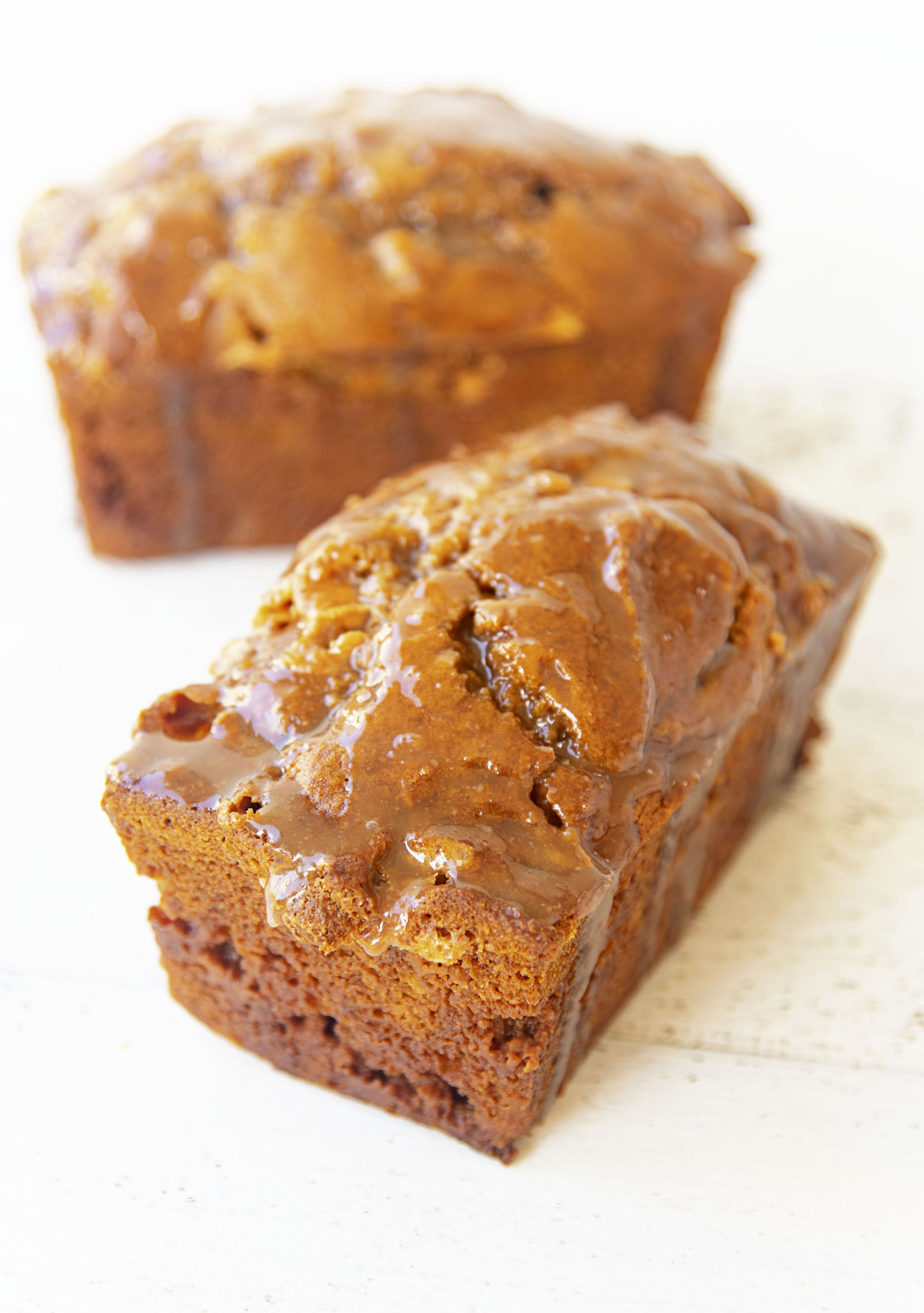 Two whole loaves of Butterscotch Glazed Pumpkin Bread