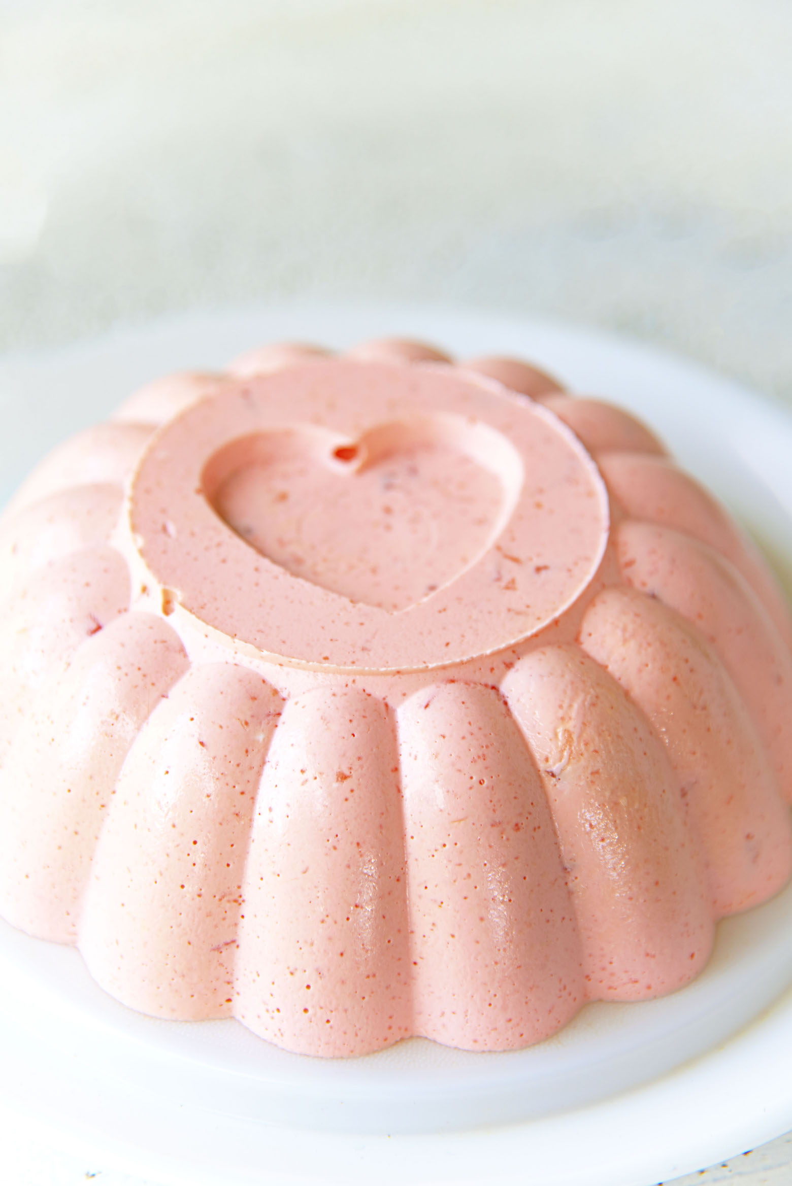 Side view of the Hawaiian Punch Jello Mold in a traditional mold with a heart on top. 