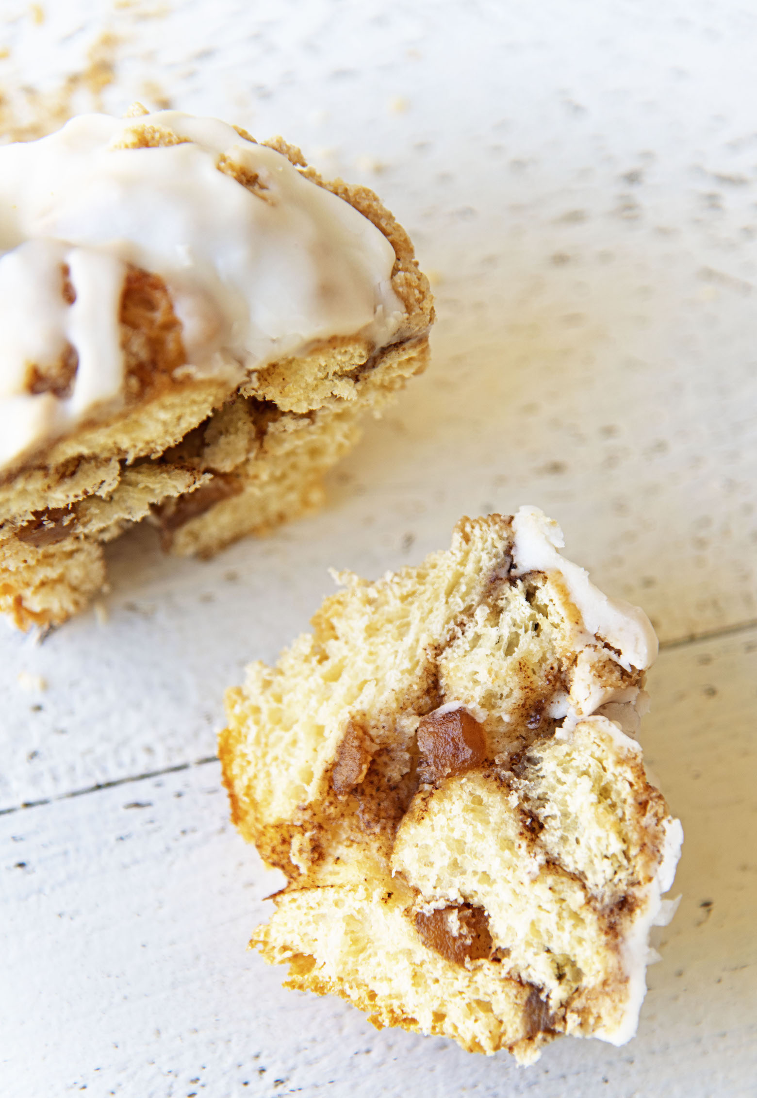 Overhead view of a cut Apple Crumb Cinnamon Roll