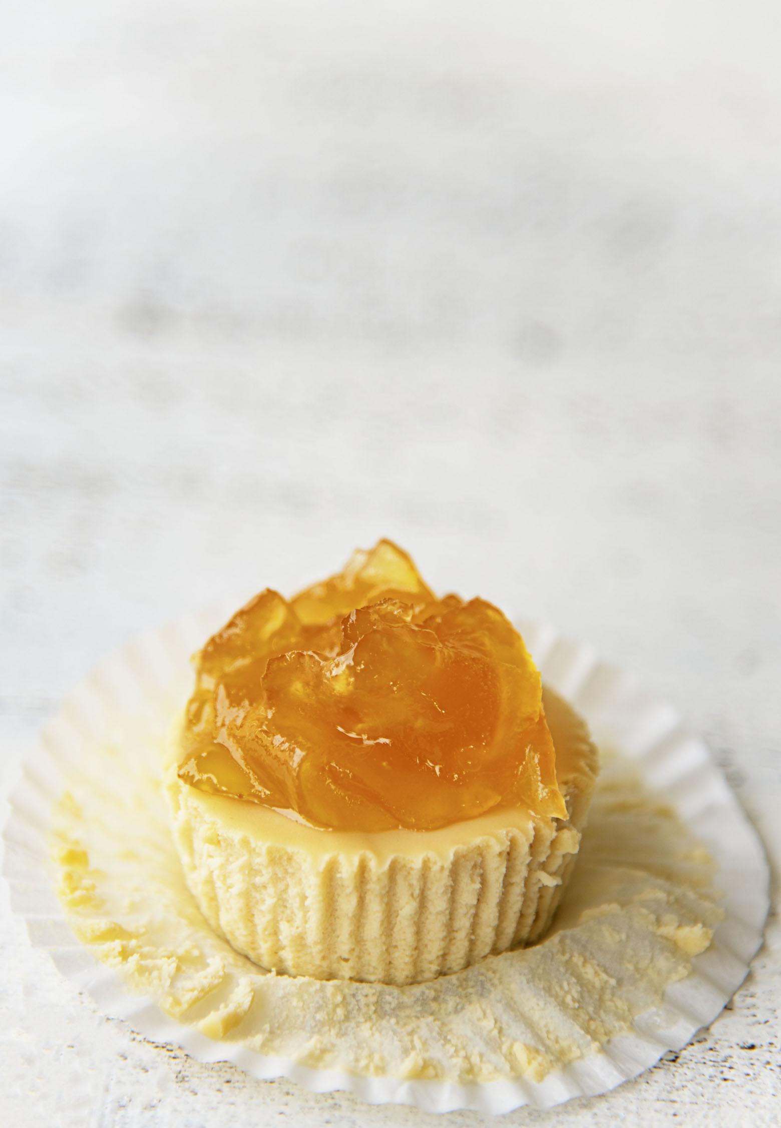 Side shot of the Apple Whiskey Cheesecake Bite with the paper liner down 