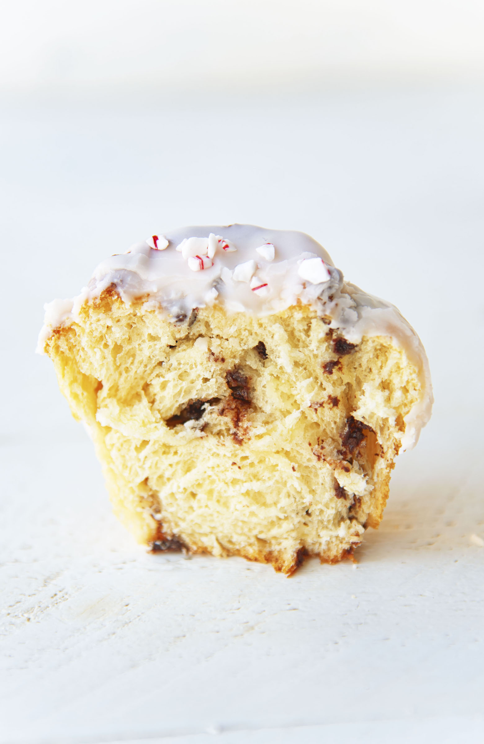 Half of a single sweet roll with filling exposed