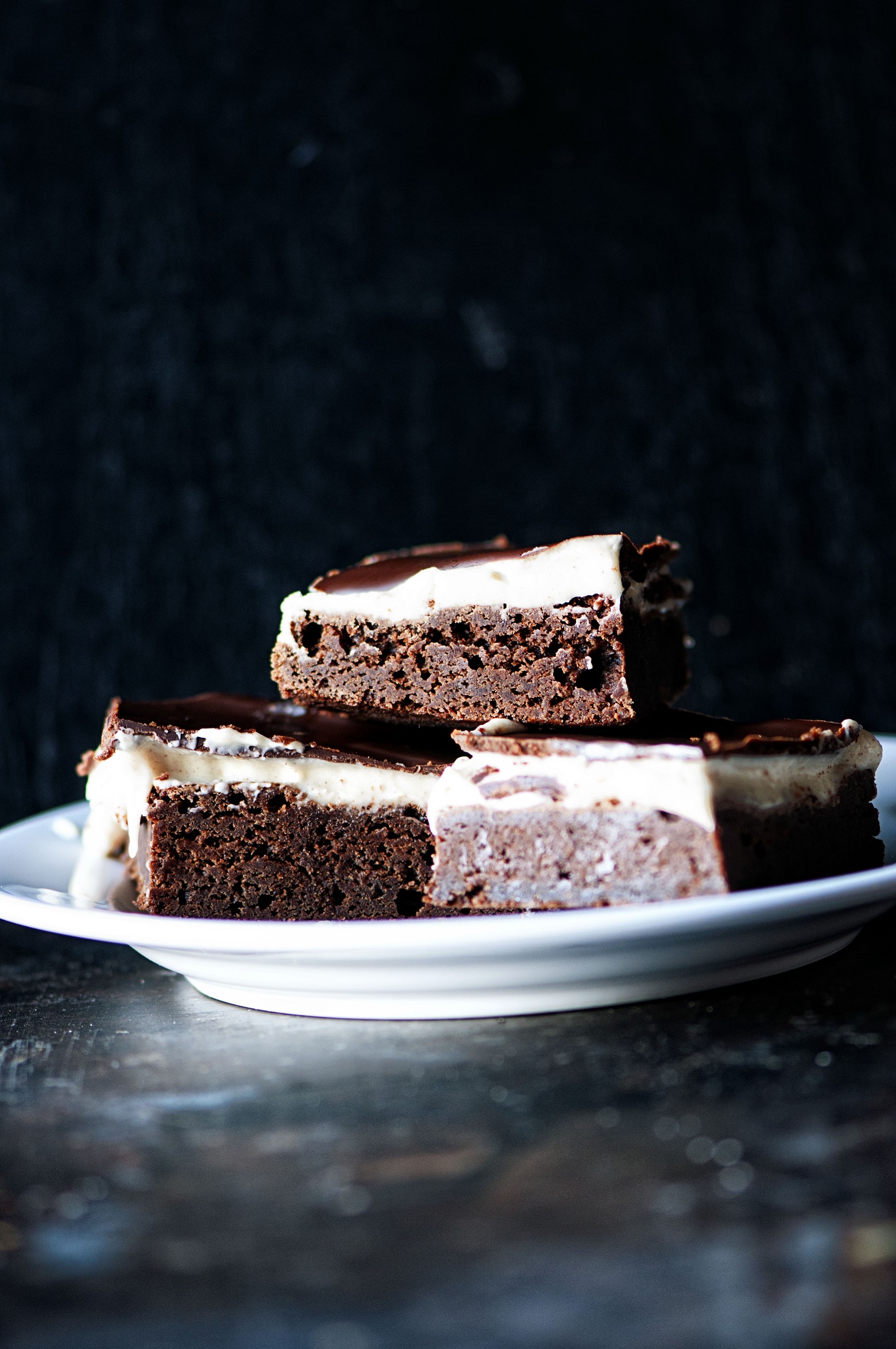 Three Cinnamon Dolce Latte Brownies on a plate.