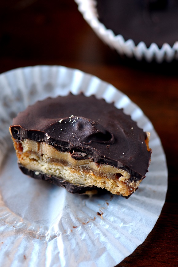Close up of the cracker toffee peanut butter cups with a bite out of them.