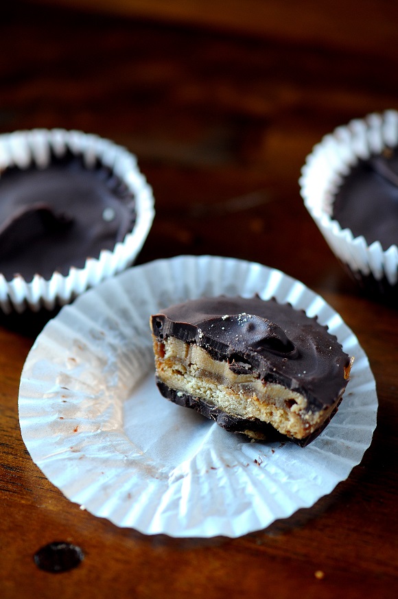 A cracker toffee piece with a bite out of it. 