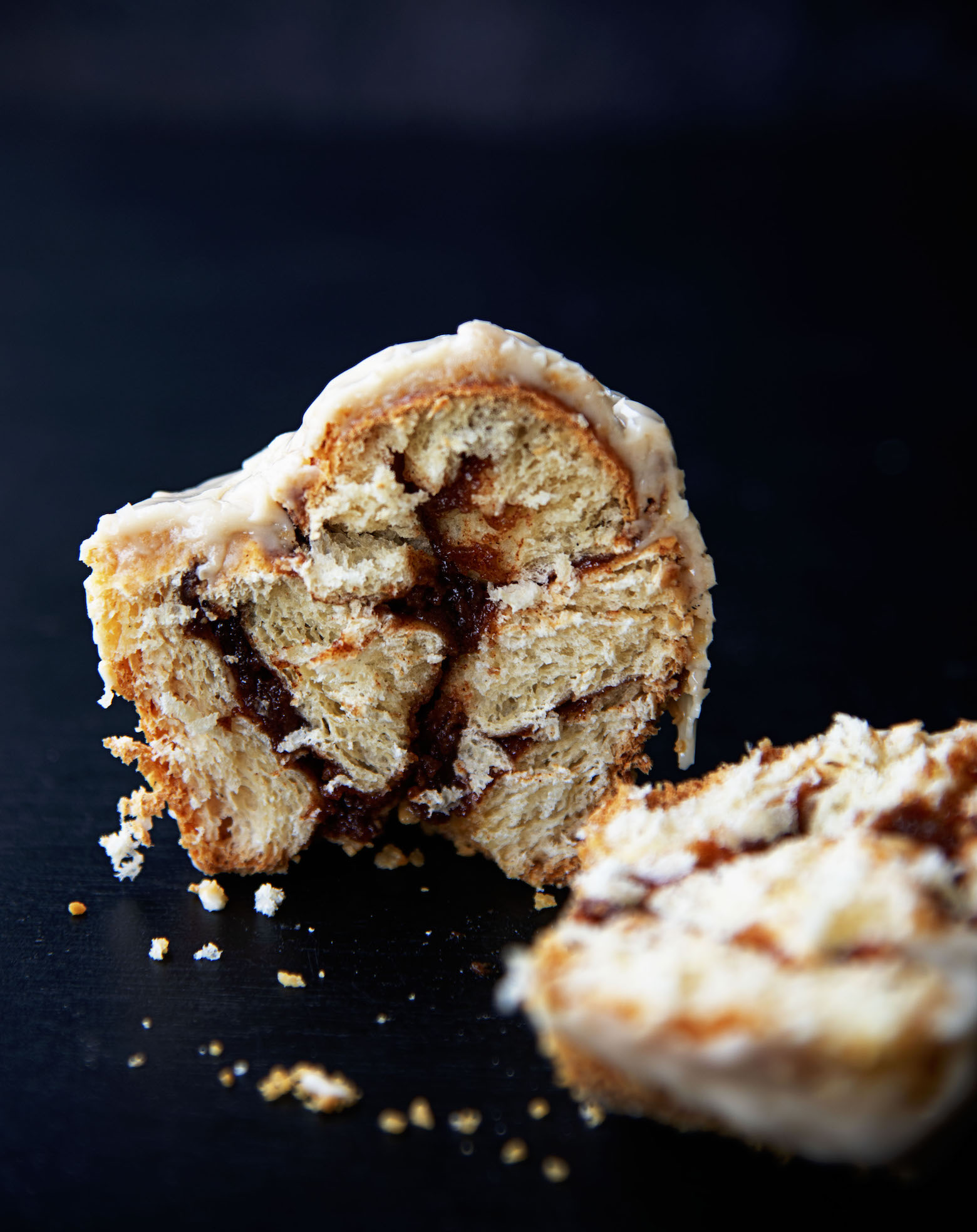 Salted Maple Cinnamon Roll cut down the middle to expose the filling.