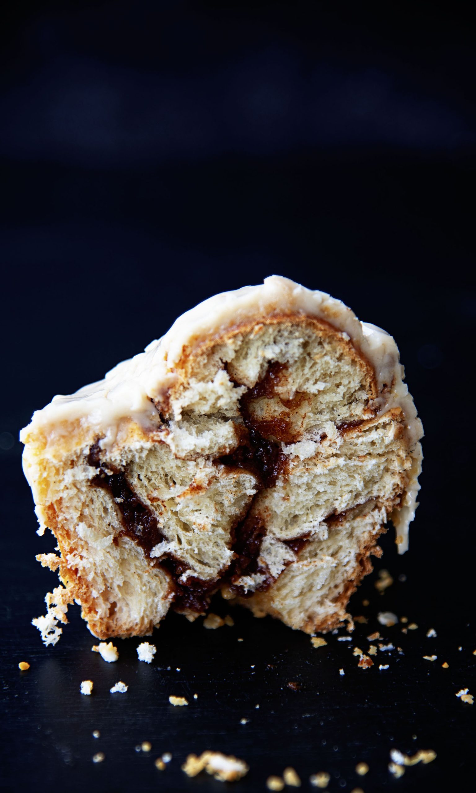 Salted Maple Cinnamon Roll cut down the middle to expose the filling.