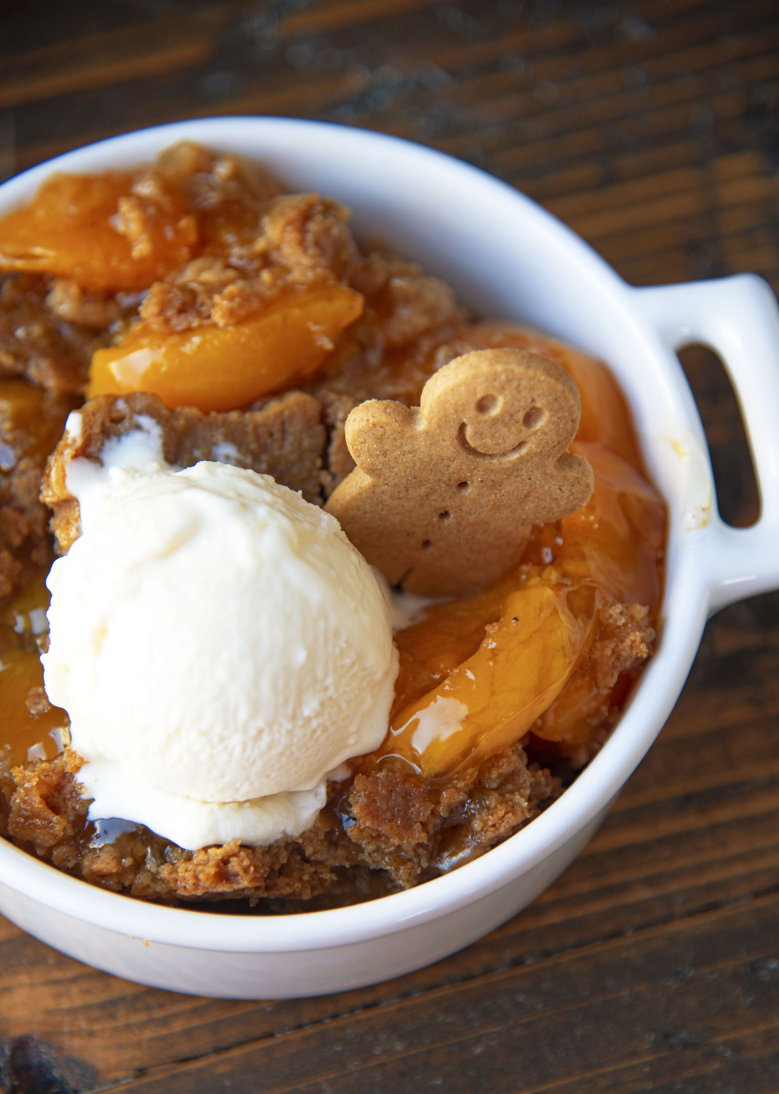 Overhead shot of the dump cake with the focus on the mini gingerbread man cookie