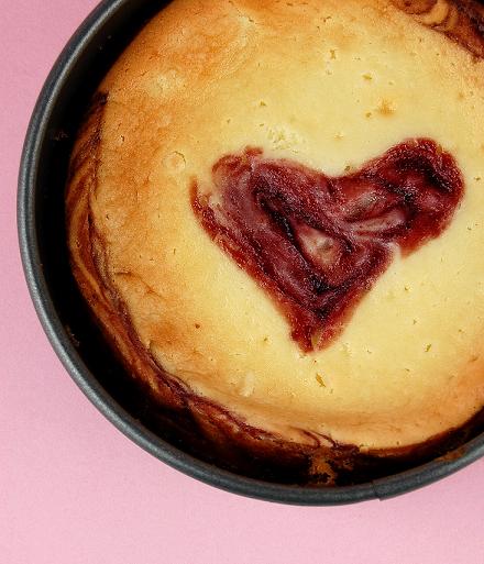 Overhead shot of the cheesecake showing the raspberry heart center.