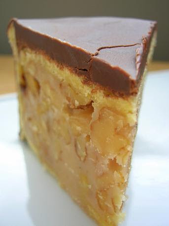 Close up shot of a slice of Chocolate Walnut Caramel Cake