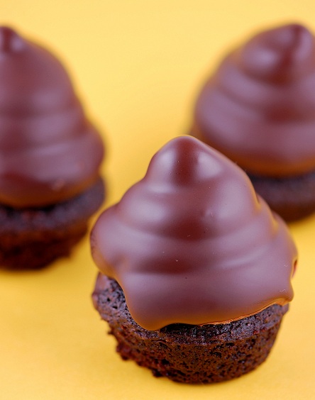 Three mini cupcakes with a yellow background.