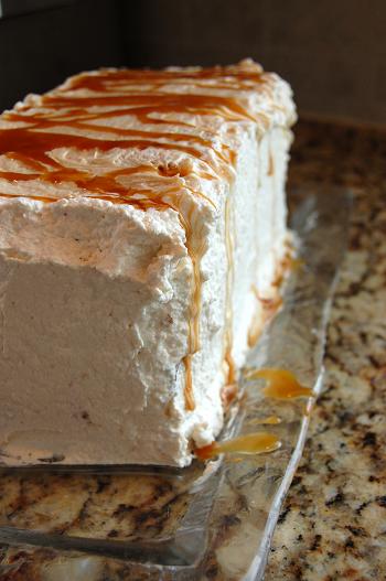 Frosted Peanut Butter Dulce De Leche Banana Cake on a platter