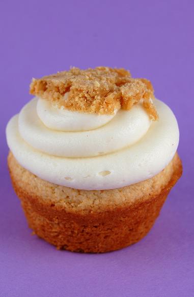 Single Honey Peanut Butter Crunch Cupcake with a focus on the frosting and crunch. 