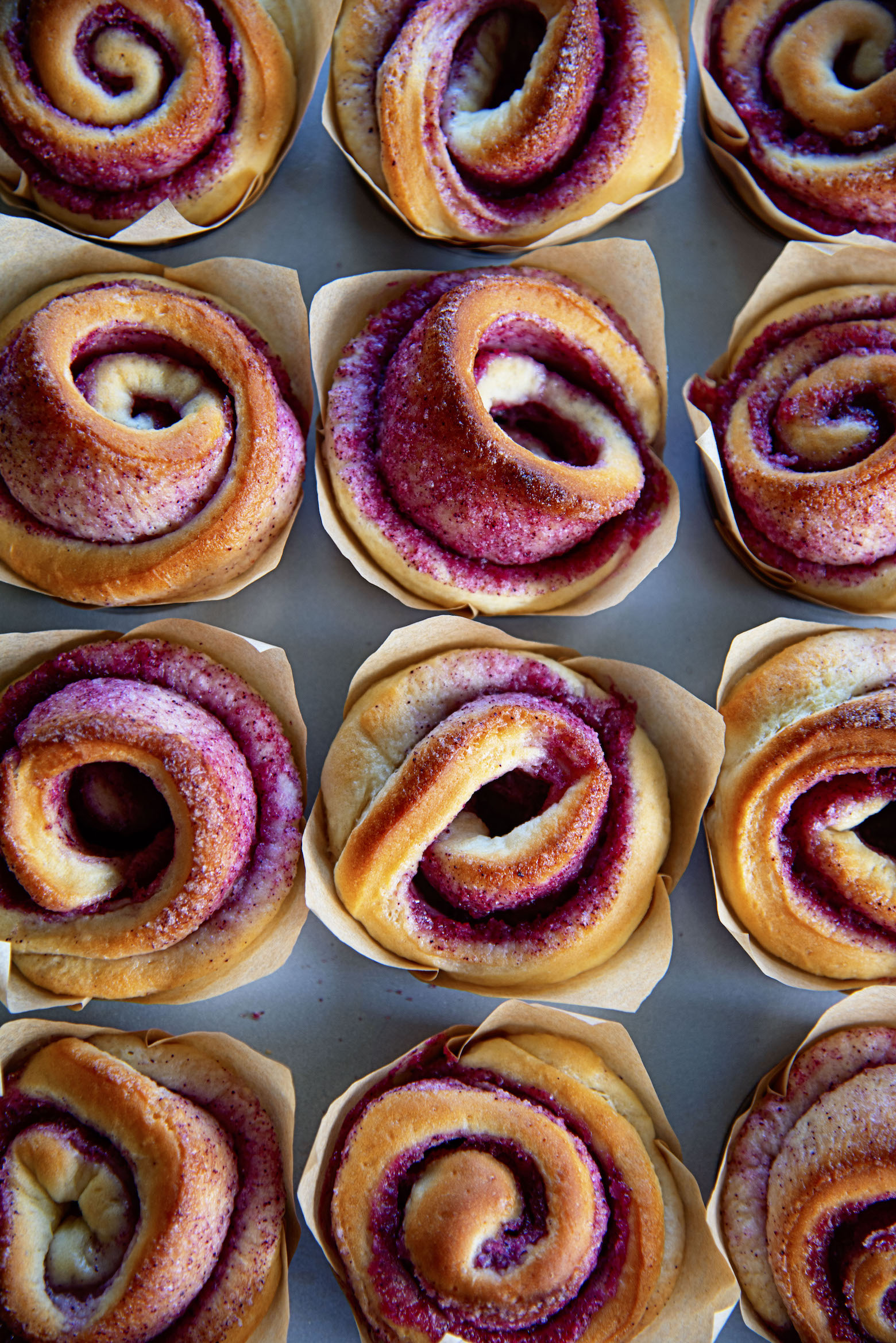 Overhead shot of the Kir Royale Sugar Buns still in the metal pan they were baked in. 