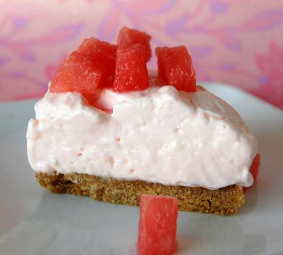 Side view of a piece of Watermelon Cheesecake with Watermelon Fresca on top.