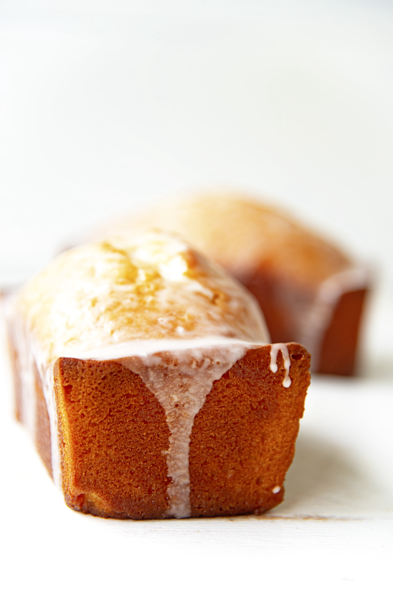 Side view of a Sweet Tea Glazed Lemon Loaf with glaze dripped down. 