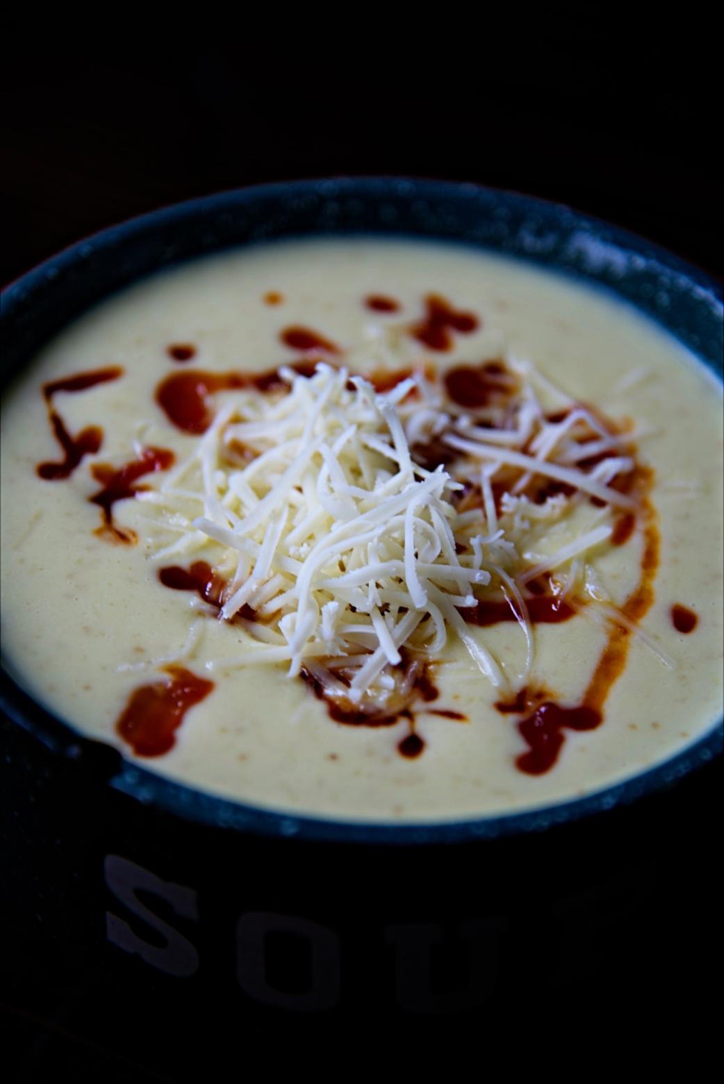 Close up of the topping on the Asiago Soup. 